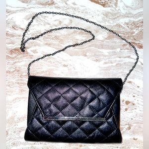 Black quilted cross body clutch with chain super stylish